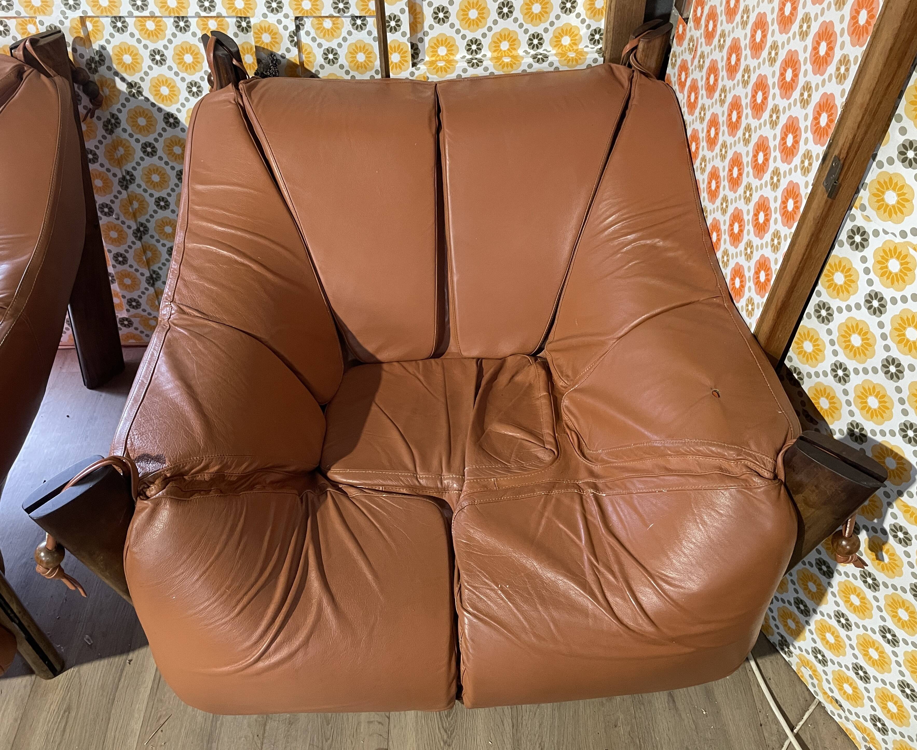 Percival lafer mp-211 sofa set with two armchairs and an ottoman in leather.