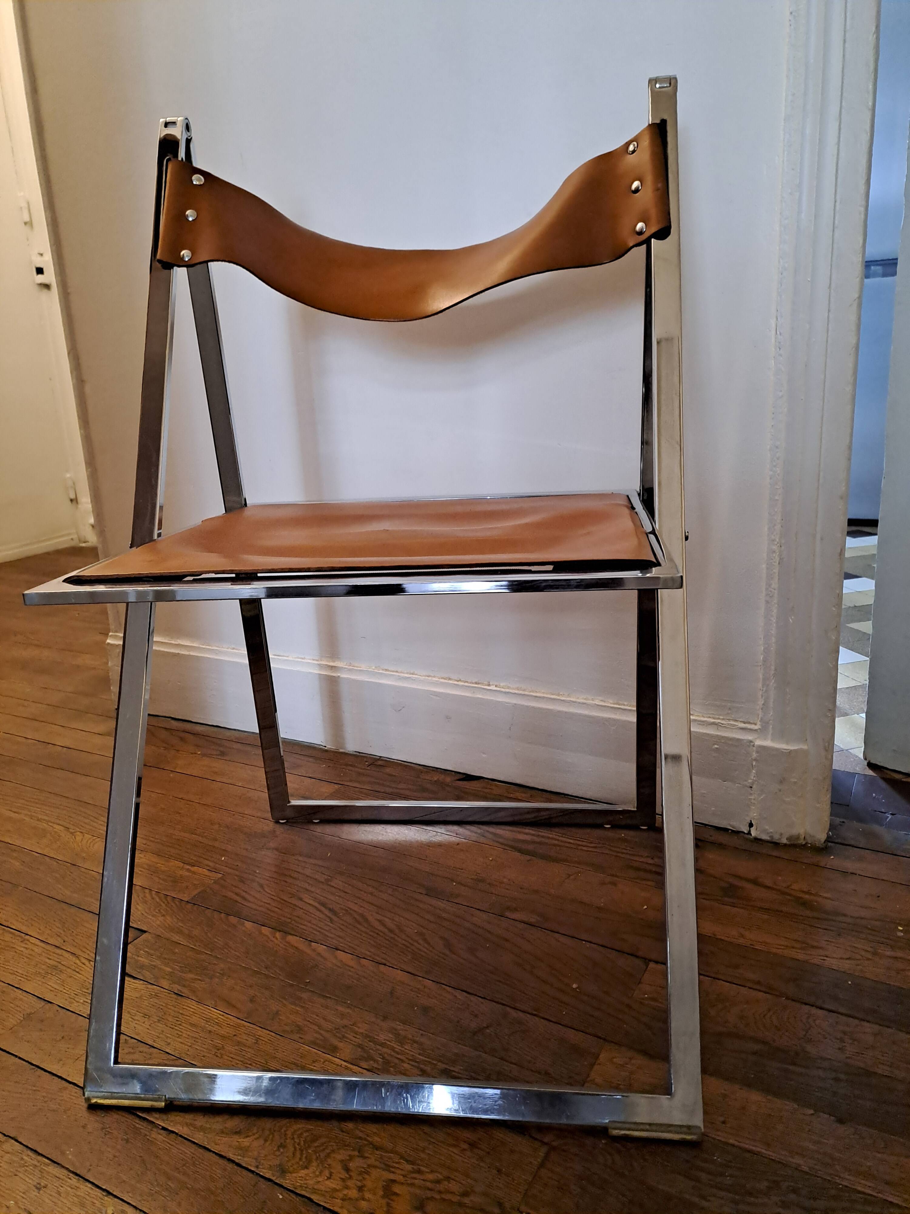 2 Chromed metal and leather folding chairs. 70s. Fontoni & Geraci