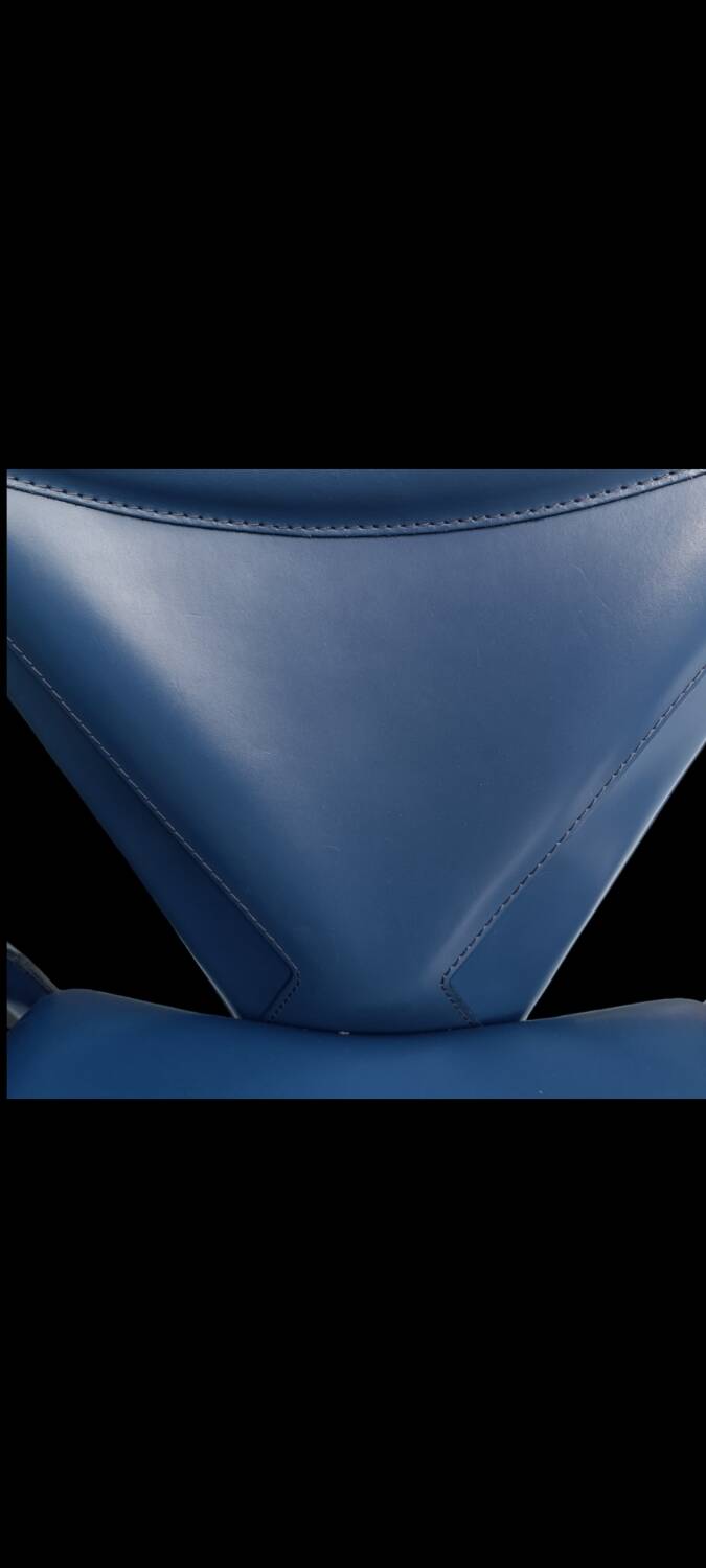 Armchairs covered in vintage blue leather