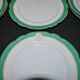 Paris porcelain set of 12 flat plates with green border and gold monogram JC.