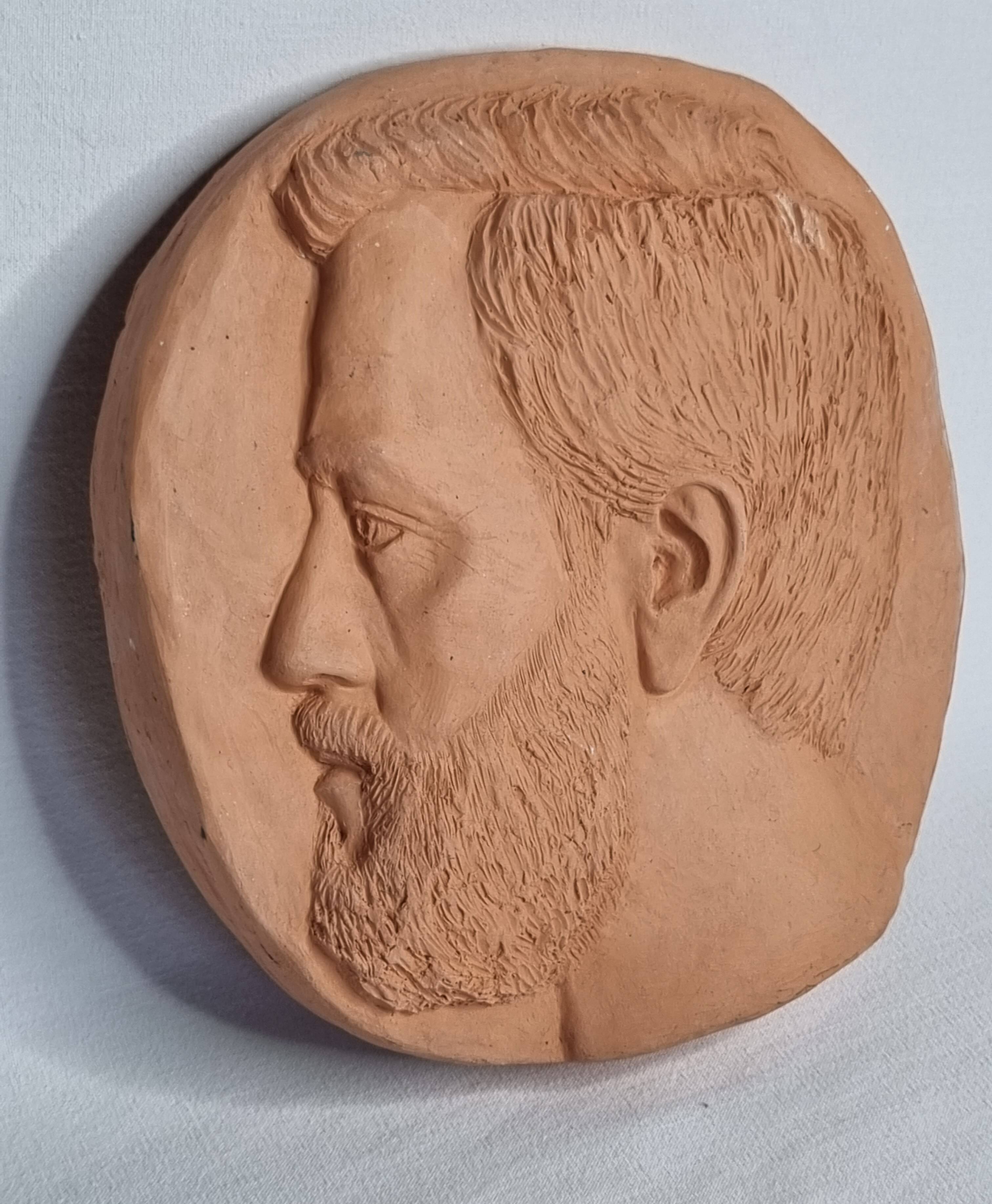 Bas-relief mural in terracotta, profile of a man, signed, 21 x 20 cm, 1984.