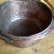 large copper and bronze cauldron