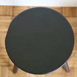 Black tripod wooden stool