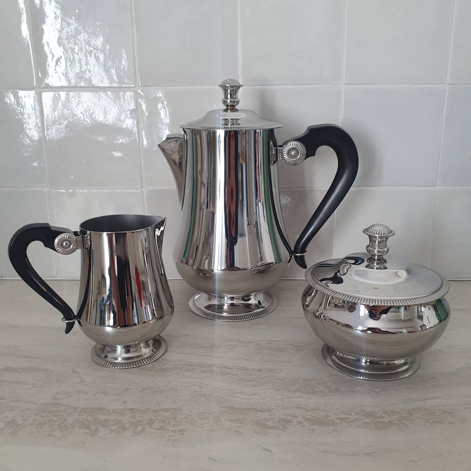 Rémy Letang / Teapot, milk jug and sugar bowl in 18/10 stainless steel and Bakelite