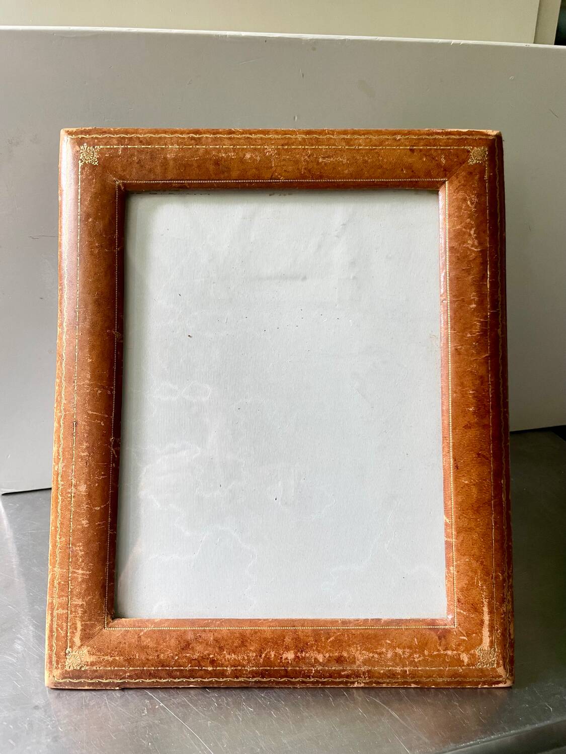 Antique  leather  with gilding frame measurements 31 cm x 25 cm