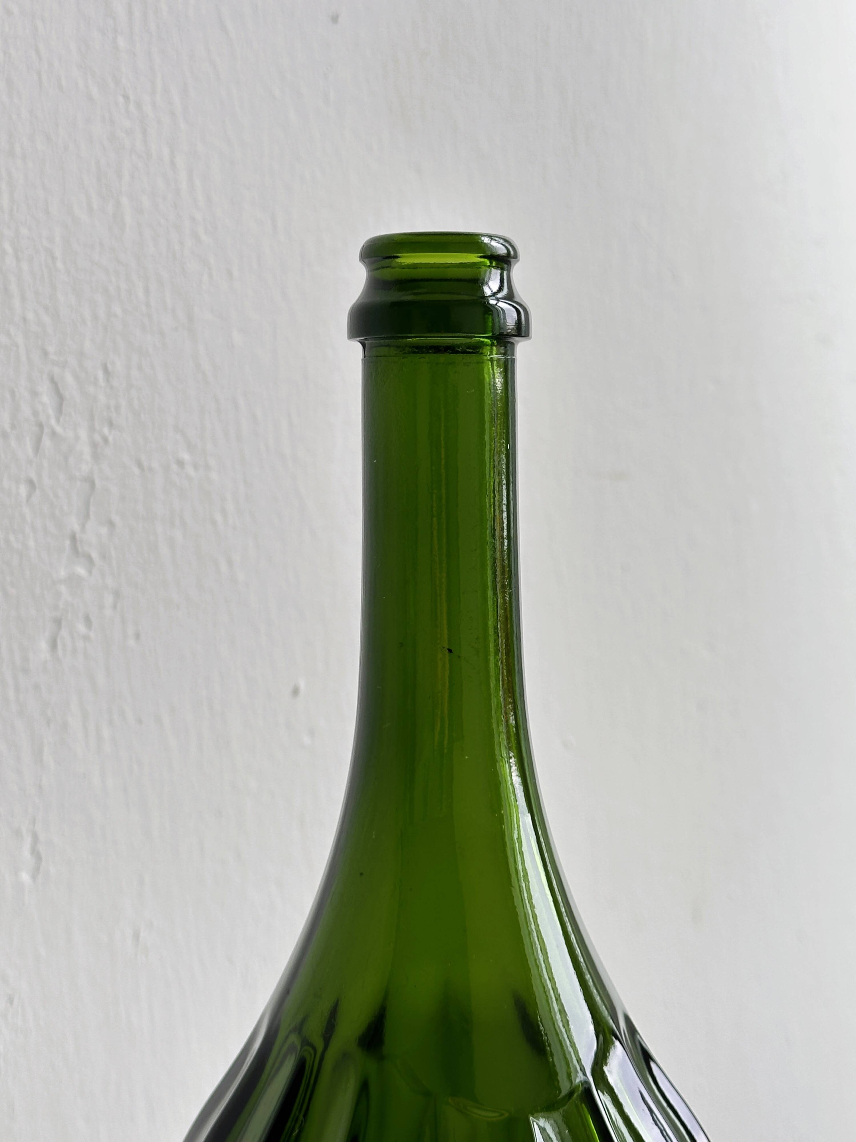 Translucent green glass bottle, classic design.