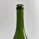 Translucent green glass bottle, classic design.