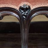 Very large Louis XV style mahogany banquette with medallions from the 19th century.