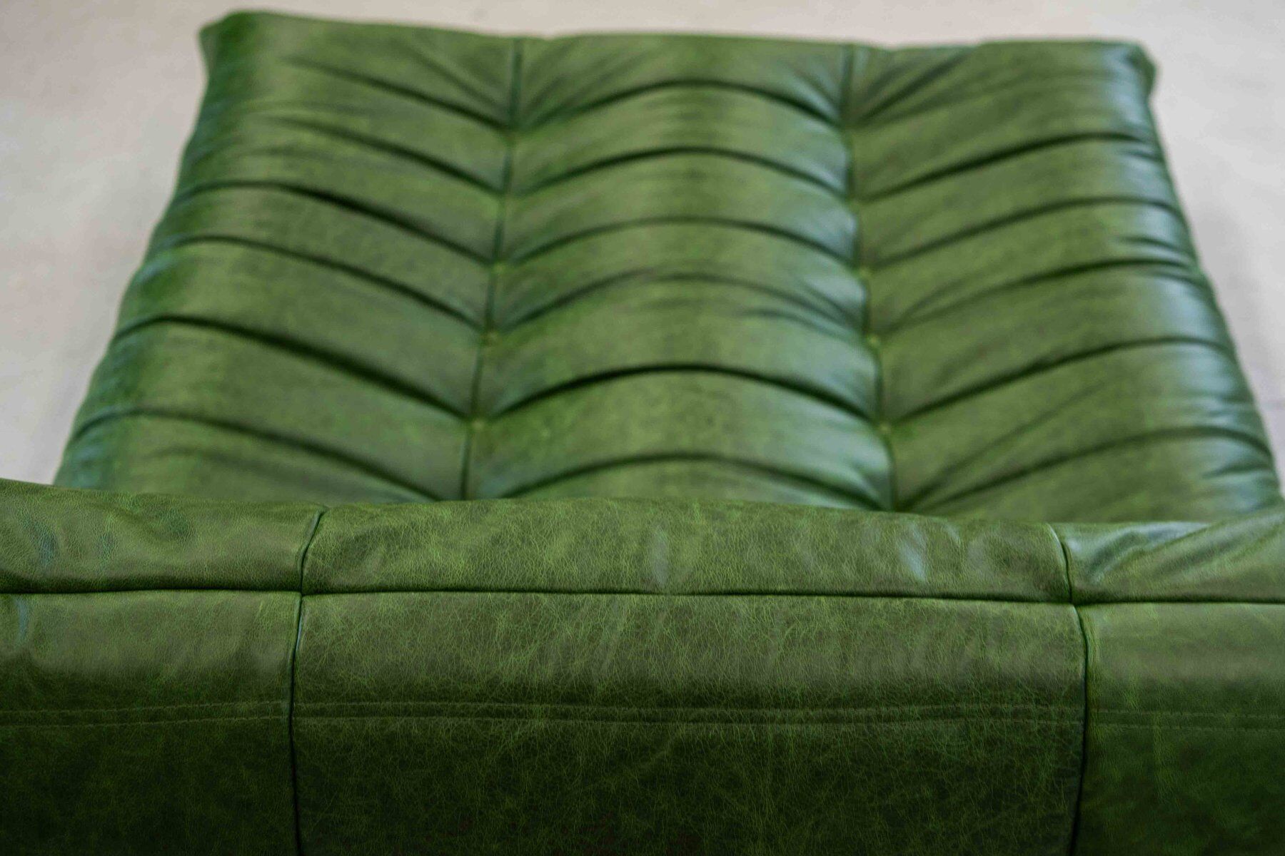 Togo chaise lounge in green leather attributed to Michel Ducaroy for Ligne Roset, 1974