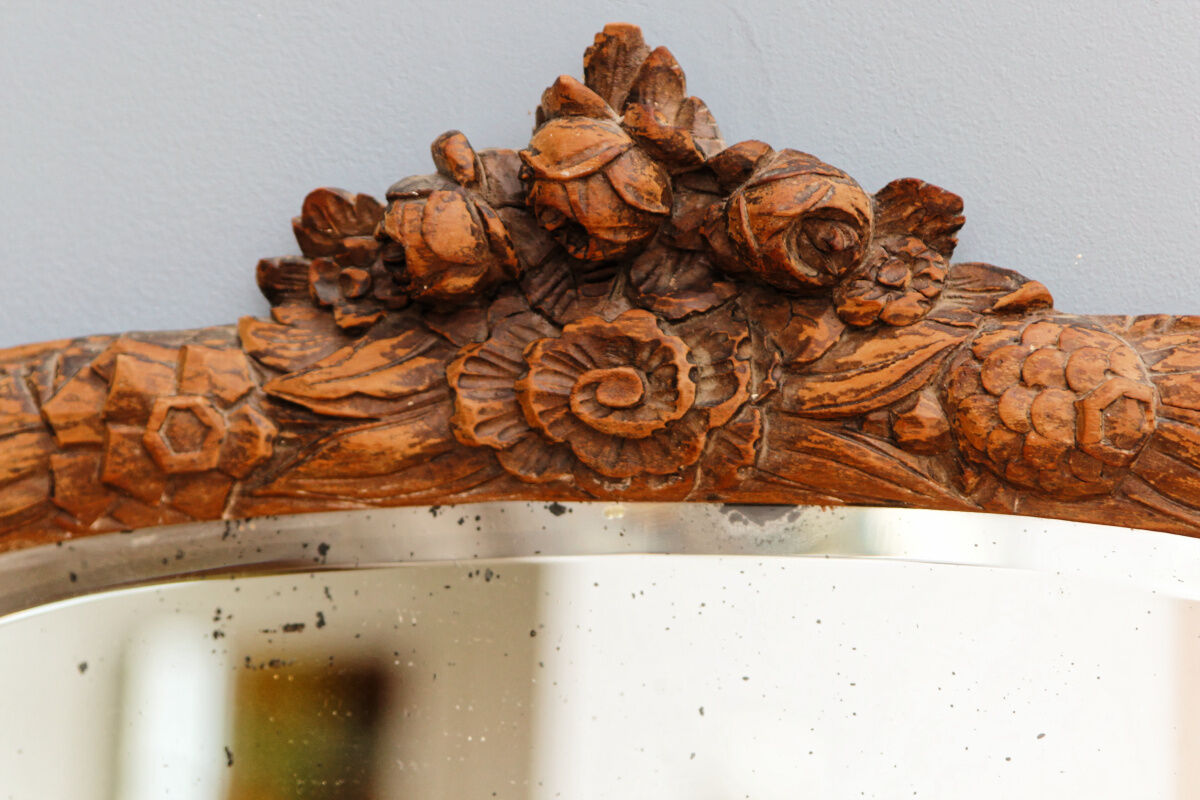 Beveled mirror in carved wood