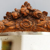 Beveled mirror in carved wood