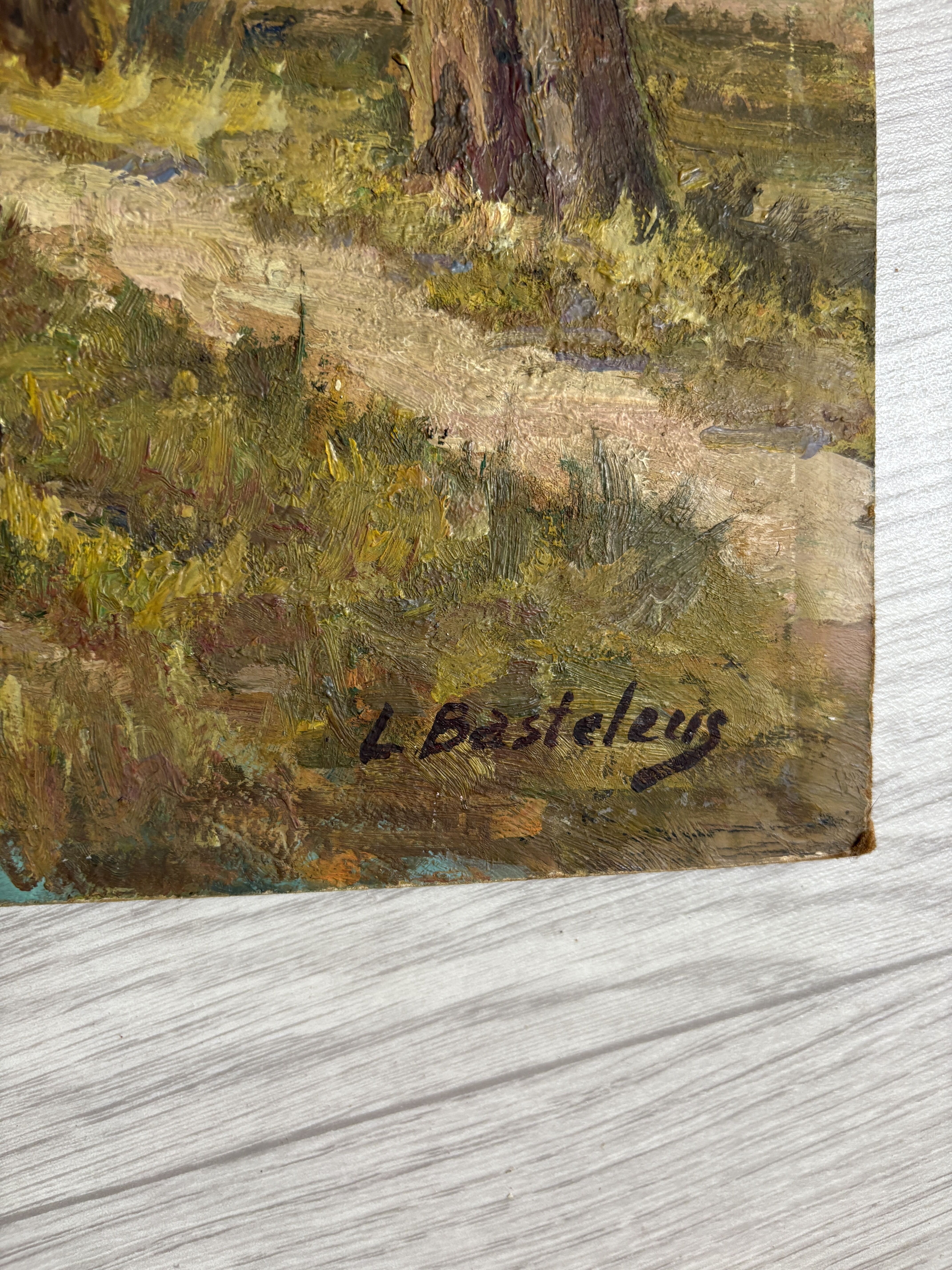 River landscape bordered by poplars, signed L. Basteleus, oil painting.