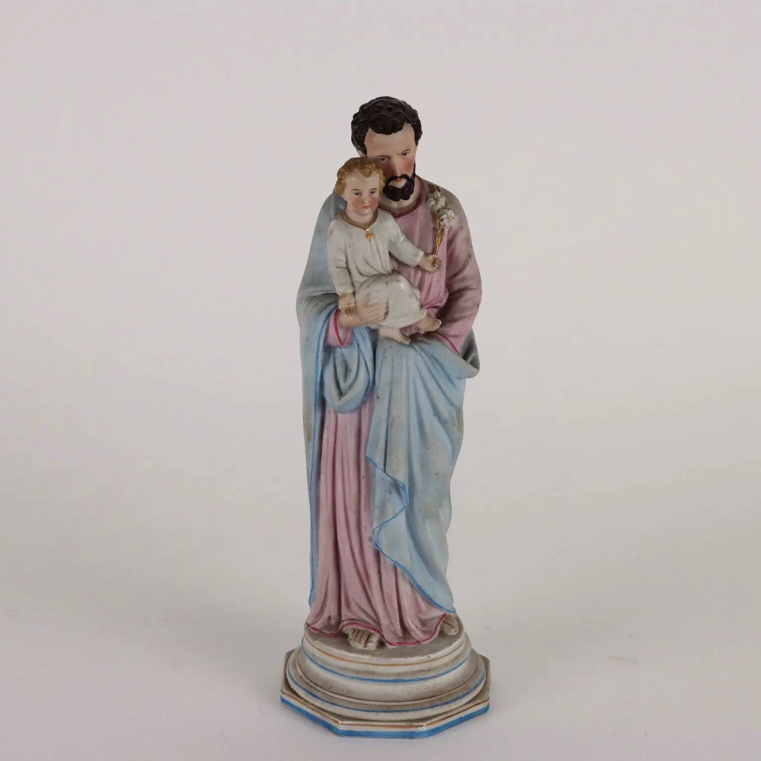 Ancient sculpture of Saint Joseph in a display case, Italy 1900s, polychrome porcelain.