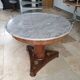 Pedestal table above marble
