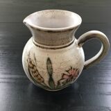 Signed pitcher with thistle decoration