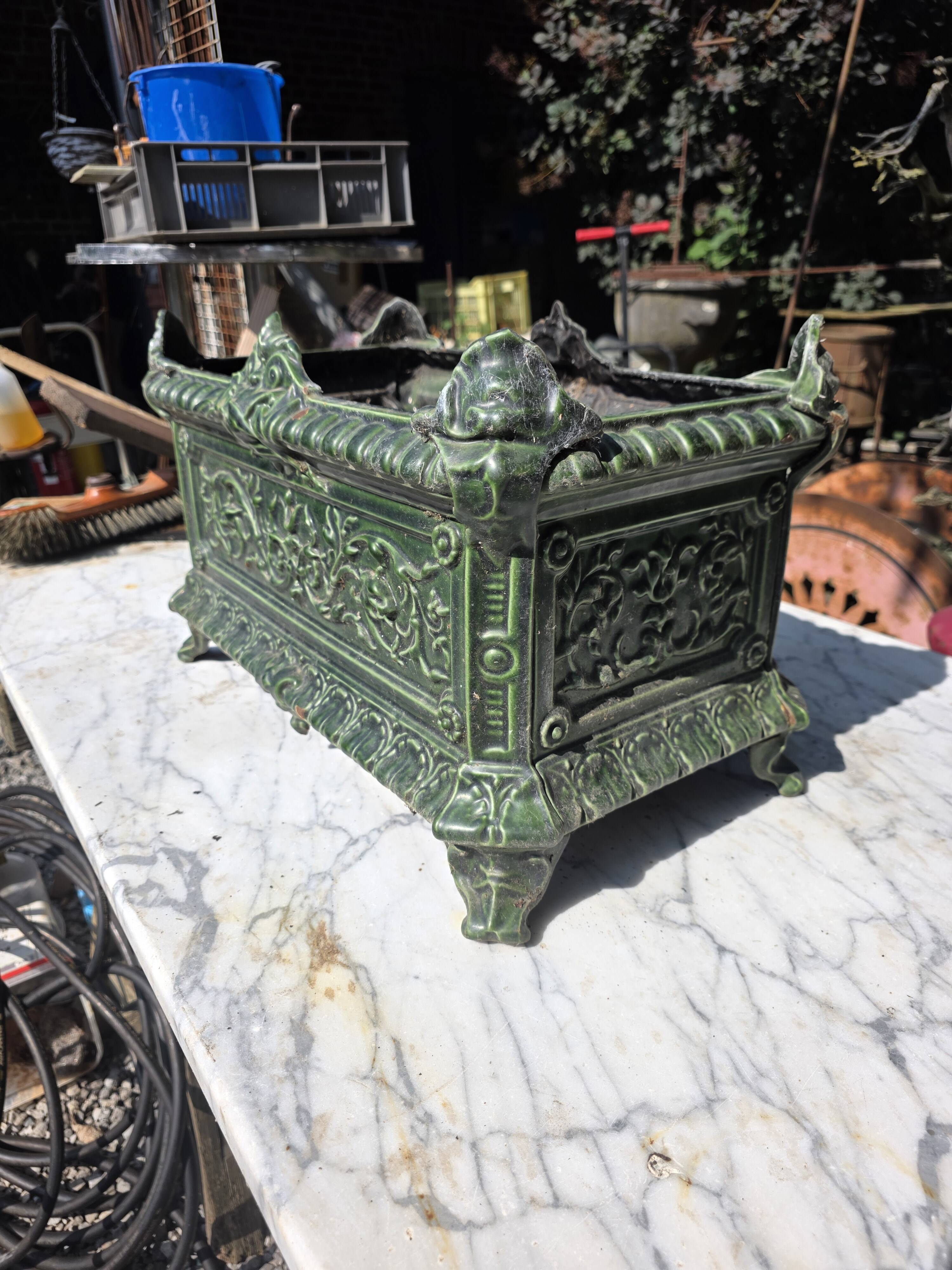 Antique enamelled cast iron planter in the Napoleon III style.