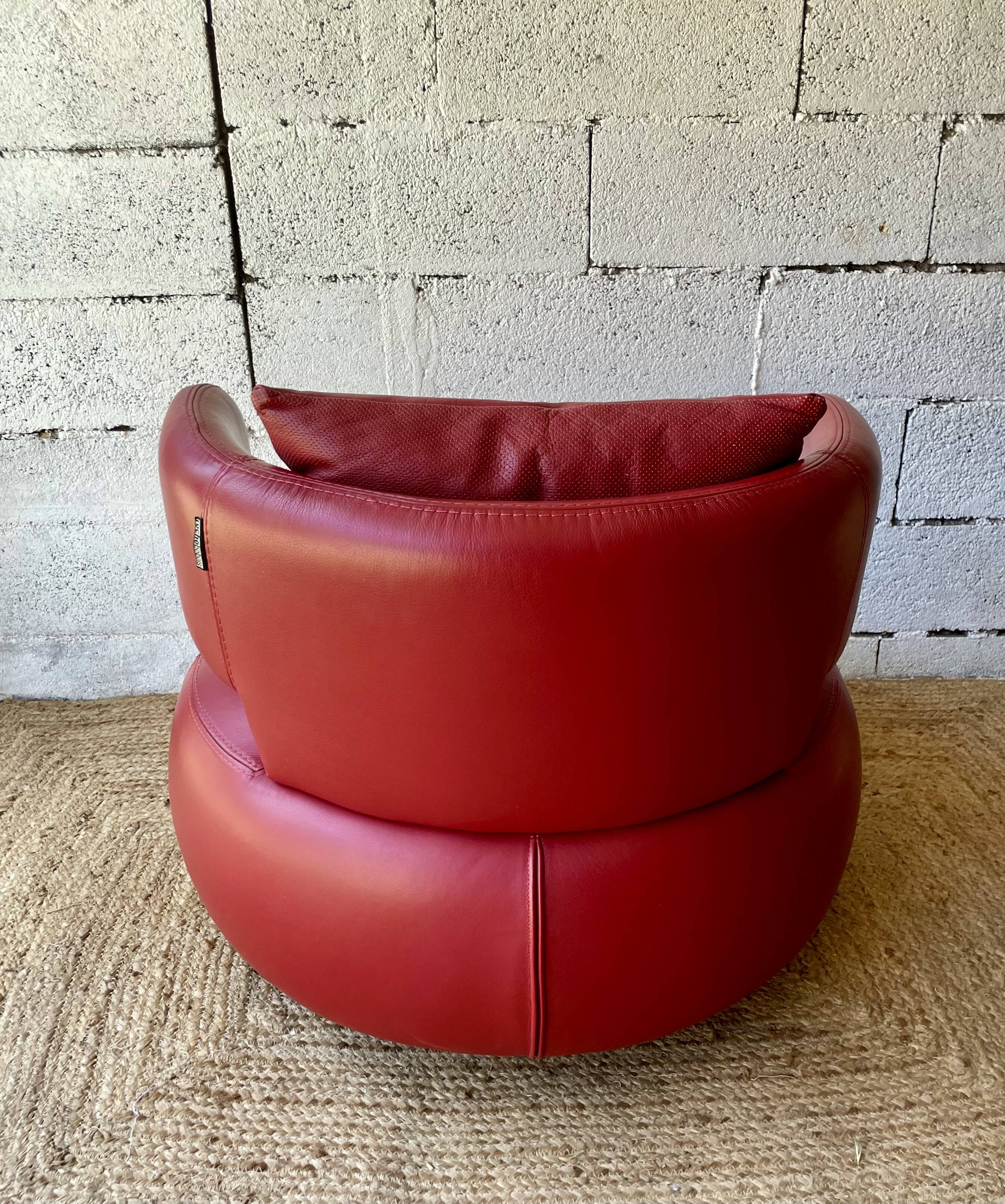 Curl armchair in red leather by Roche Bobois