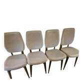 4 solid wood chairs with beige faux leather.
