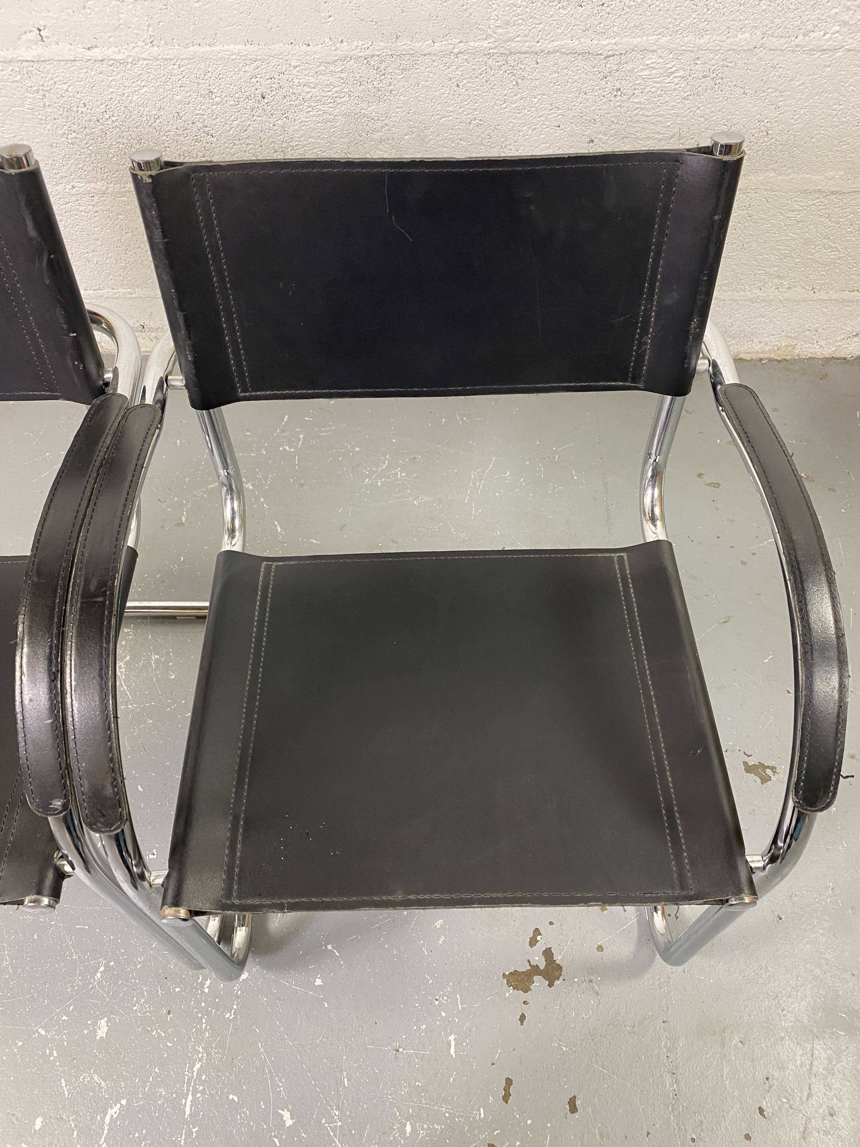 Pair of design armchairs in imitation leather chrome