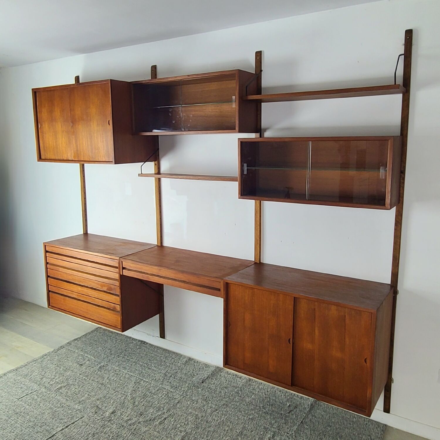 Danish wall-mounted bookshelf designed by Poul Cadovius, Scandinavian design.