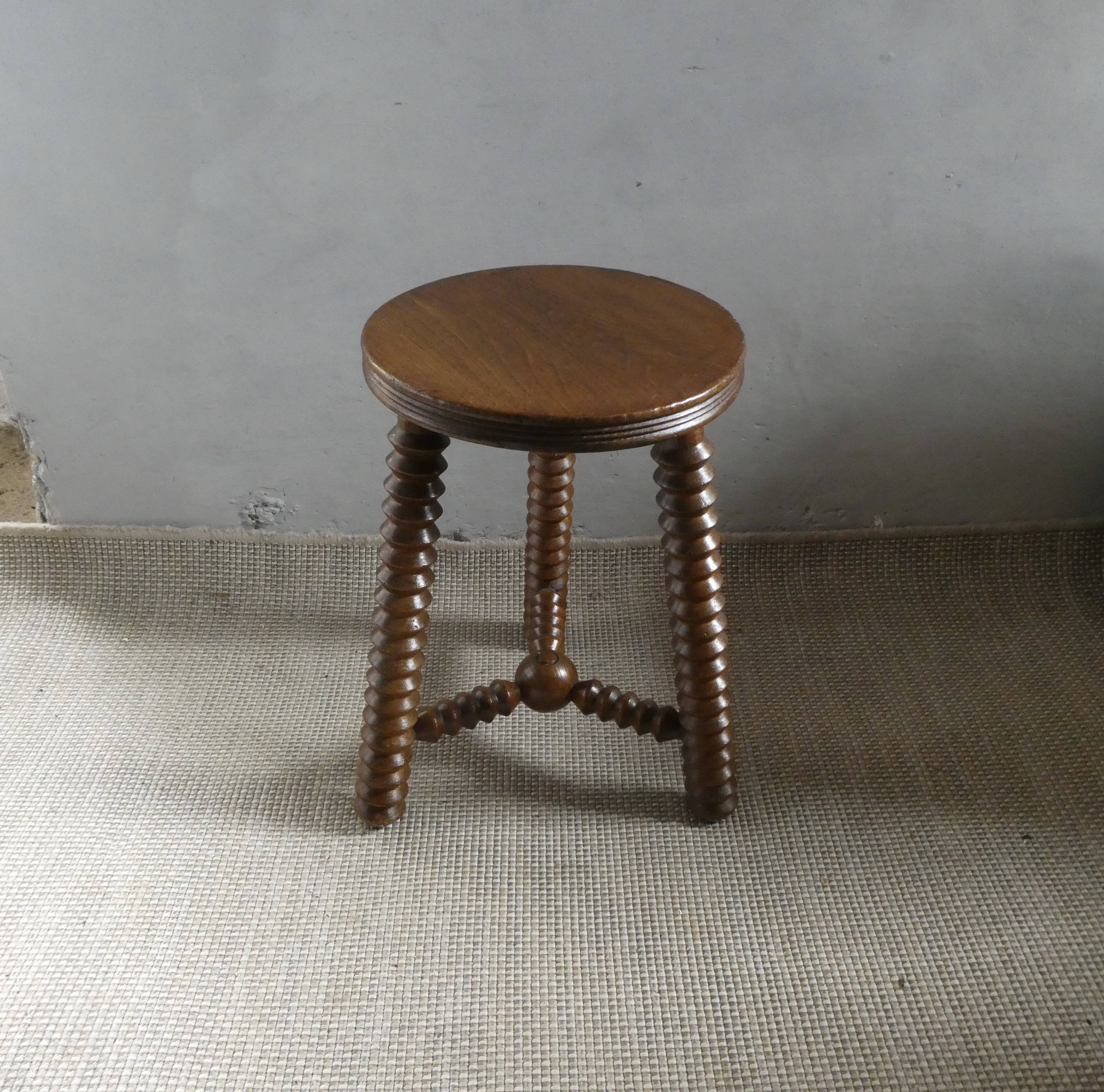 Tripod stool, with carved legs, around 1940
