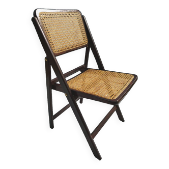 Vintage folding chair in cannage