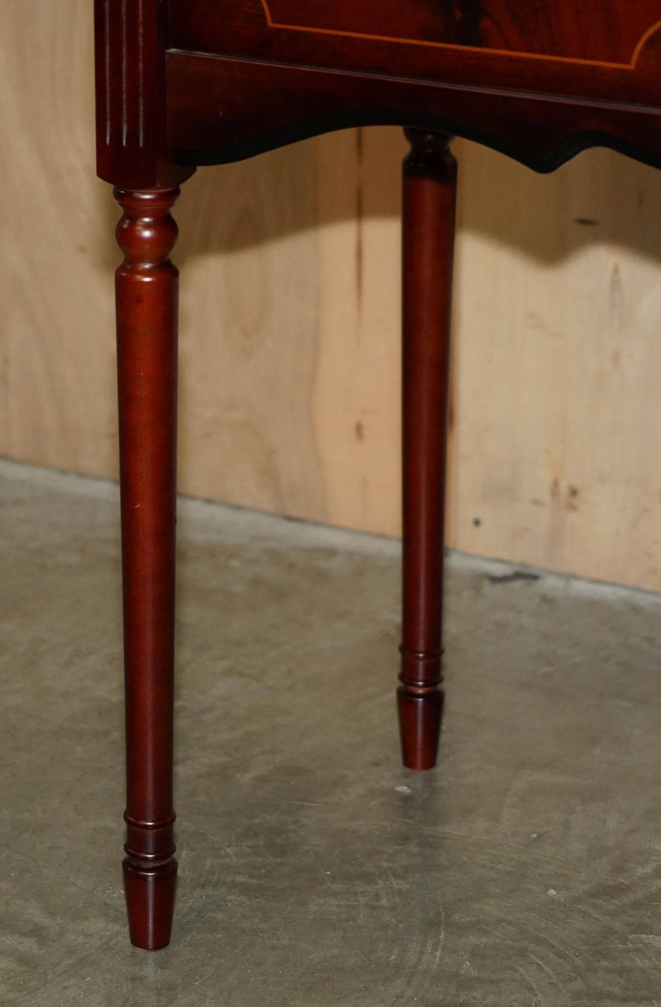 Small console with two drawers in hardwood finish.