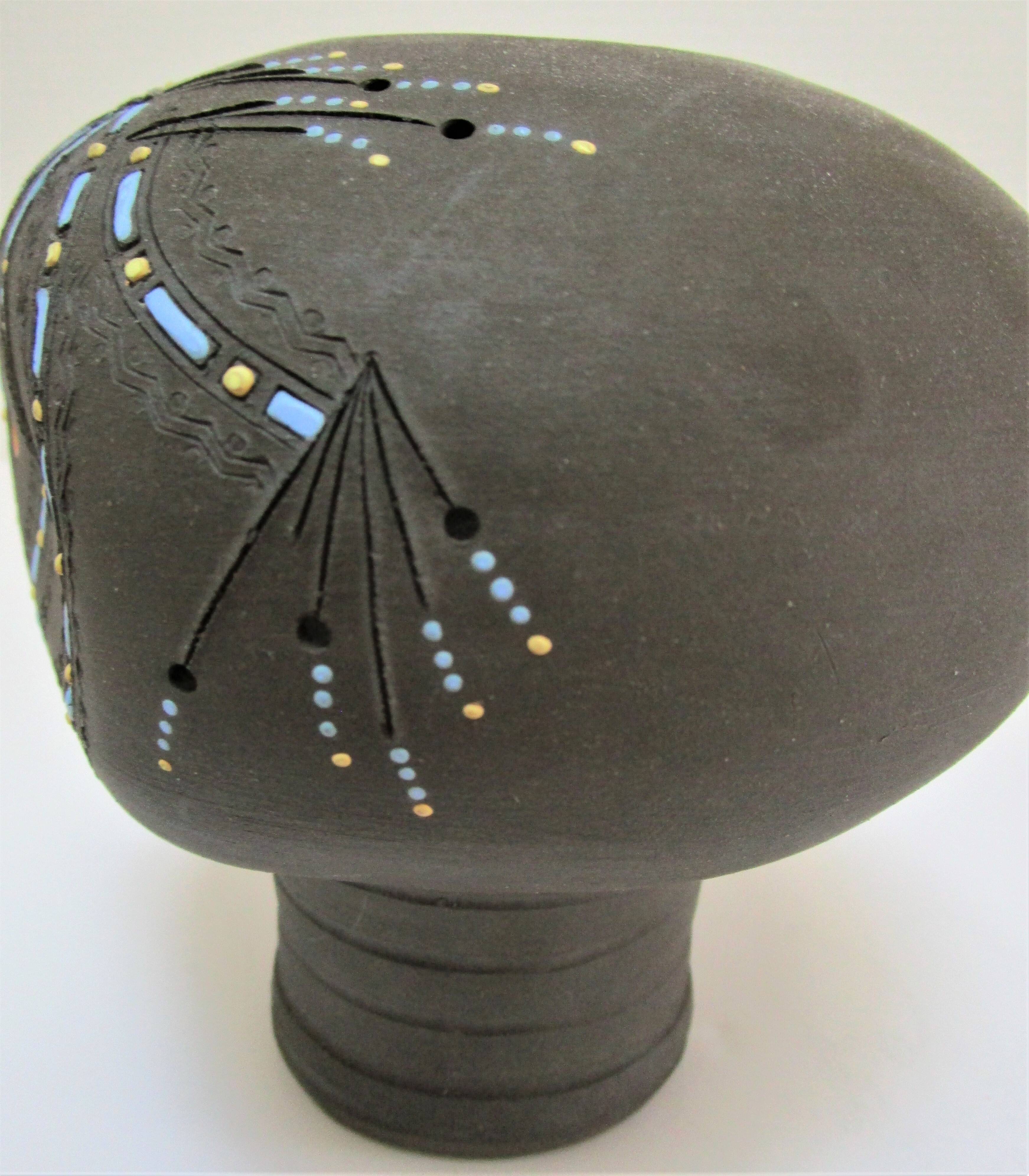 Anthropomorphic candle holder, scarified ceramic, stamped design