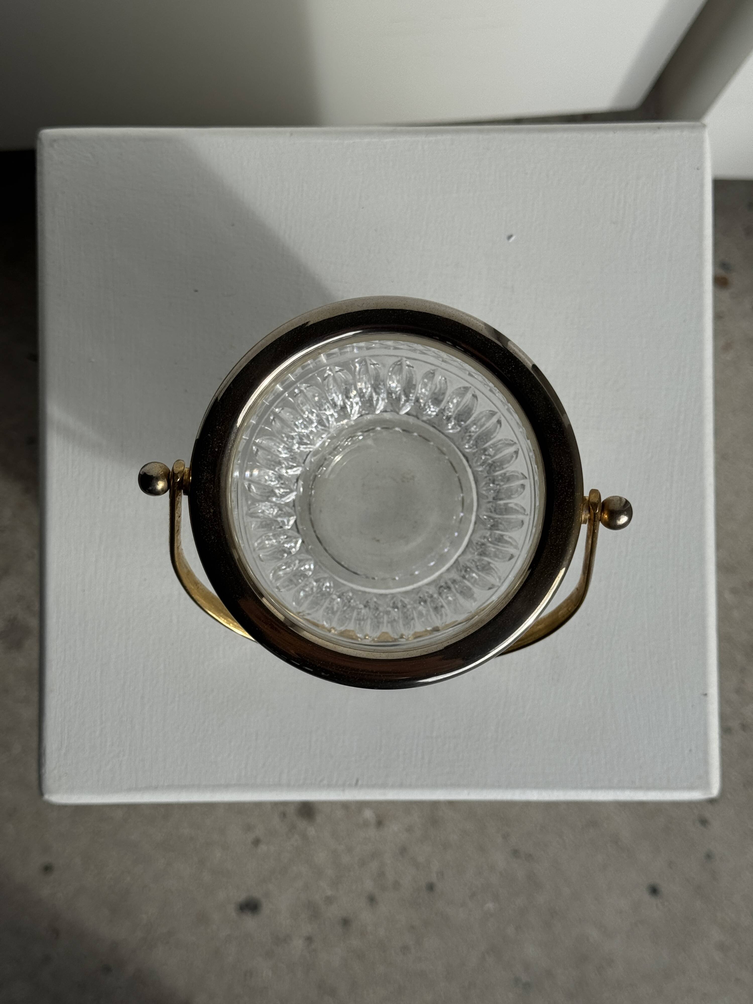 Small golden glass ice bucket with diamond point design and its scoop.