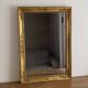Golden mirror from the late 19th century with decoration. 96x68.