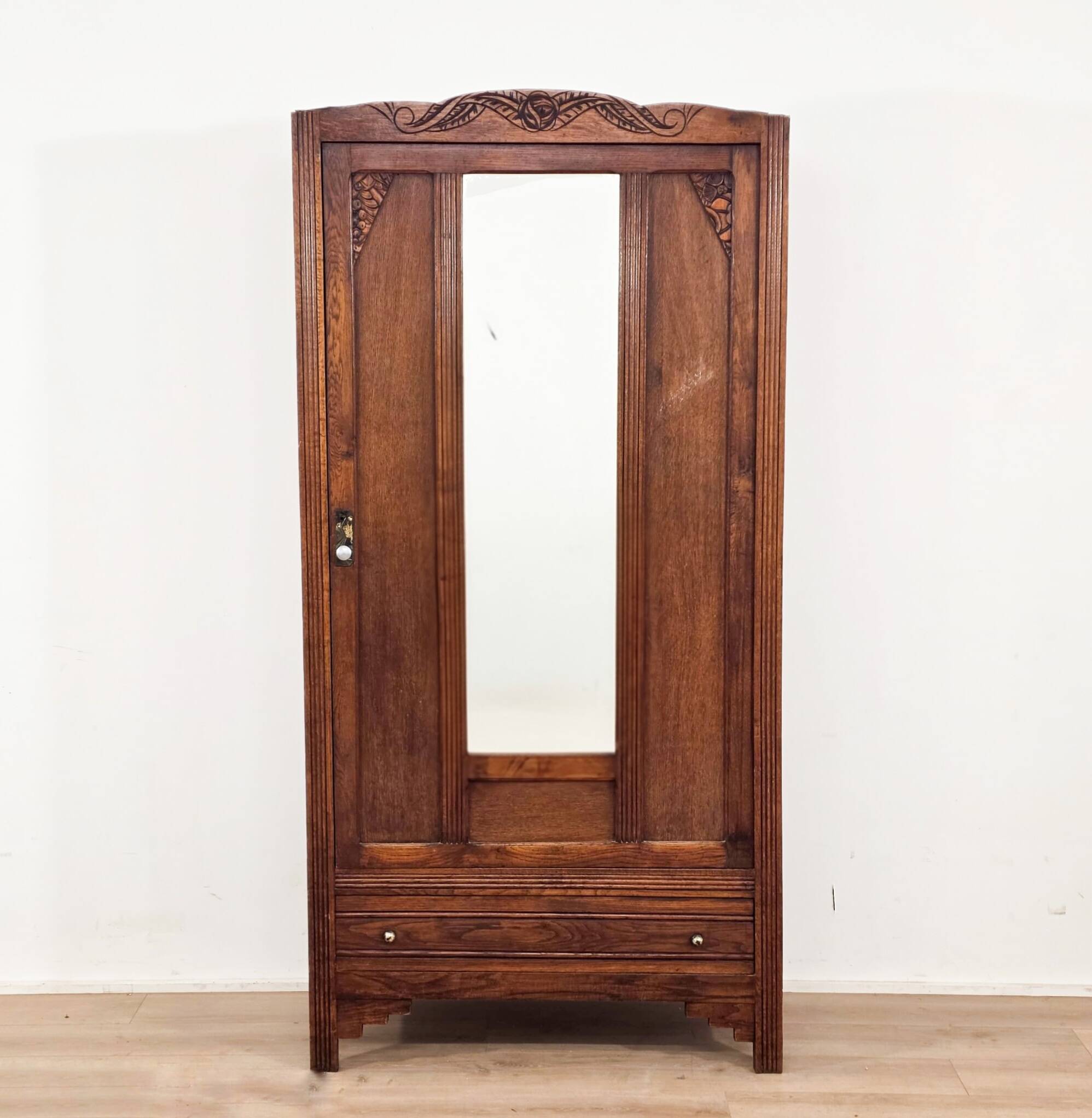 Art Deco wardrobe in solid wood with mirror from the 1920s.