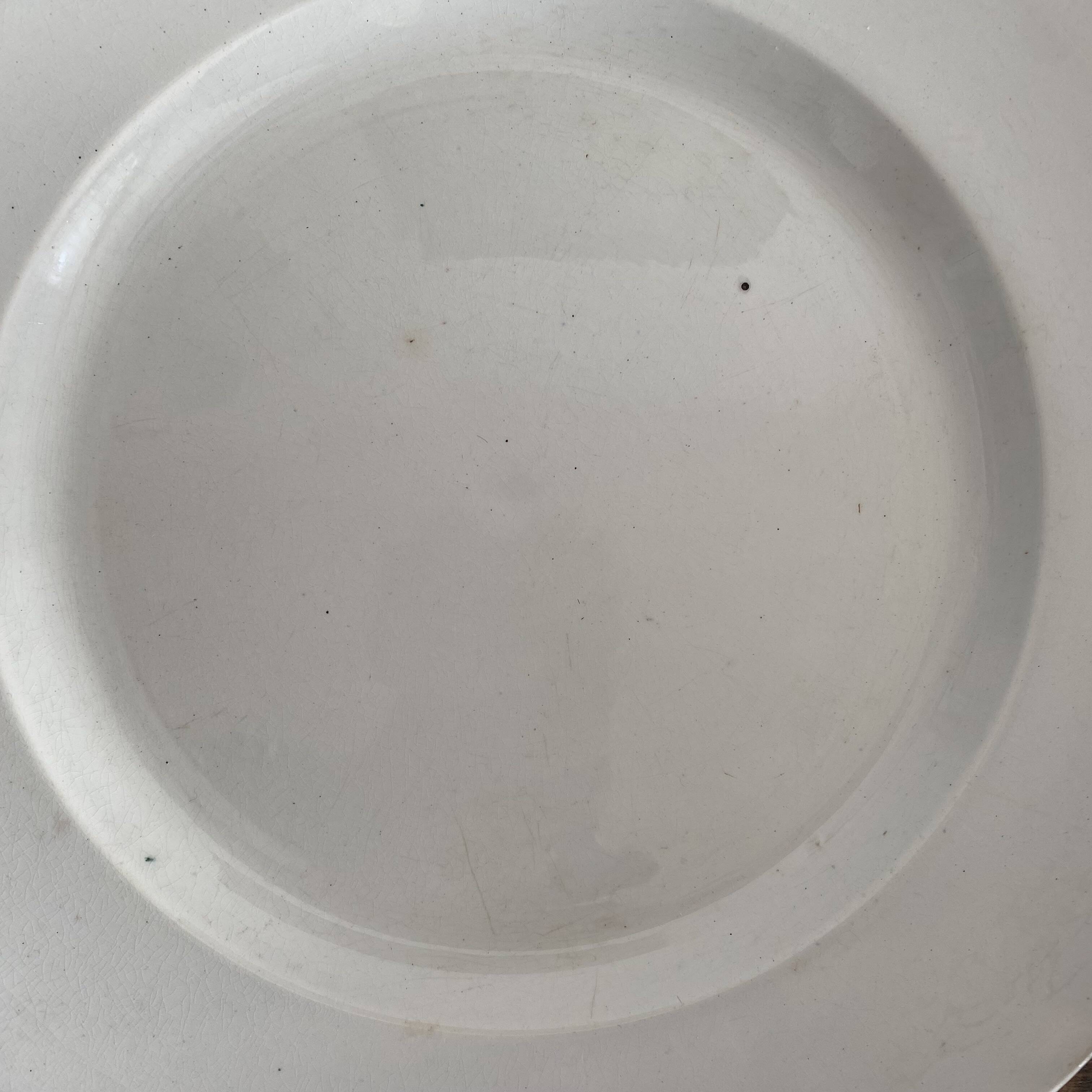 Set of large round white earthenware dishes from Creil and Montereau, 19th century