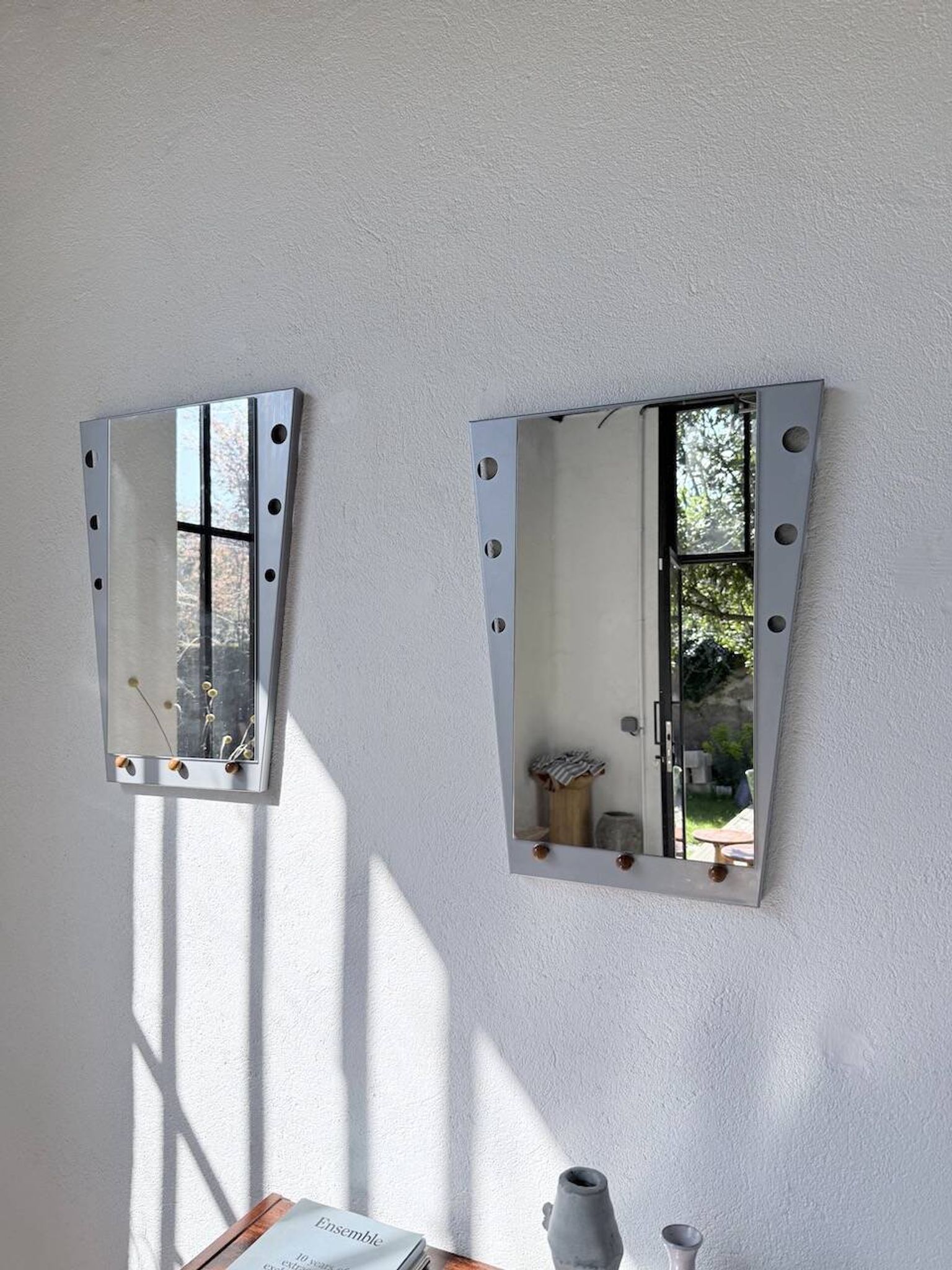Pair of "Memphis" mirrors from the 80s in chrome and wood.