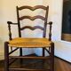 Antique Provencal armchair in wood and straw