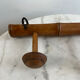 Wooden coat rack with three ball hooks.