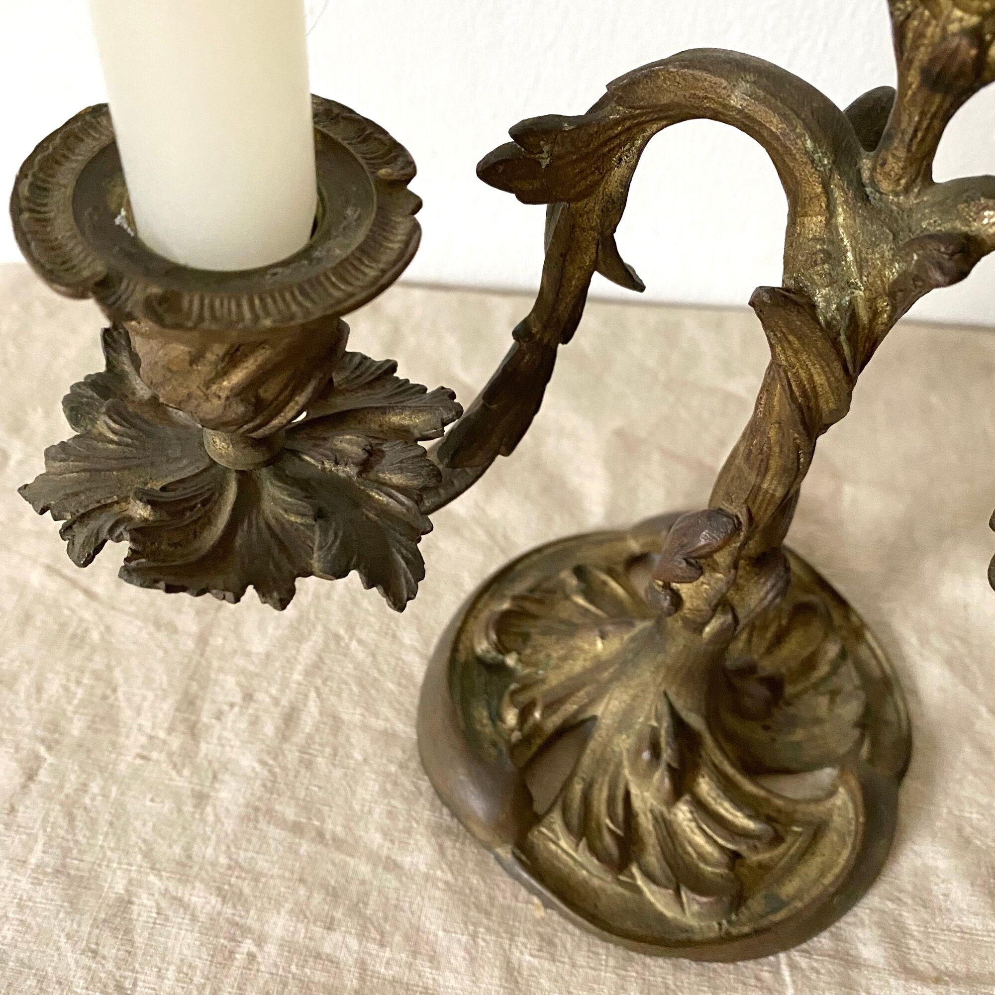 Pair of antique bronze candlesticks at the end of the table XIXth