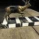 Bronze sculpture of a deer and doe in an Art Deco animal scene on a base.