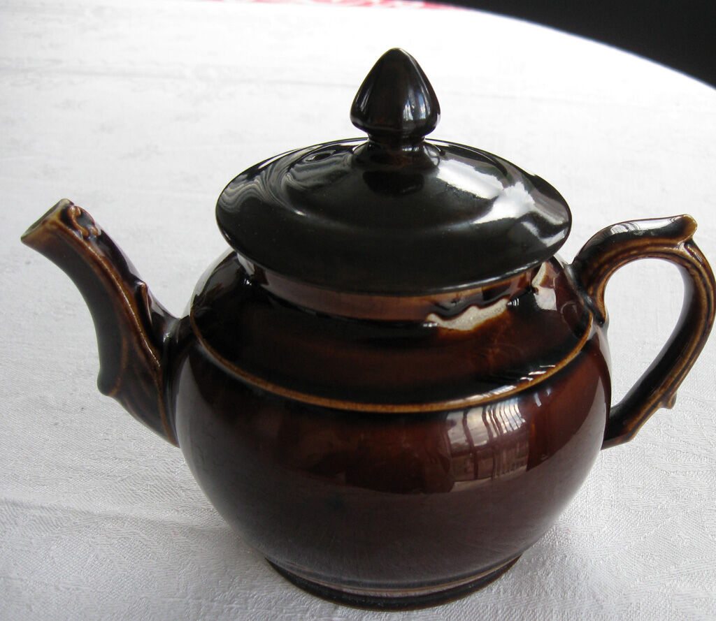 Old brown glazed ceramic coffee pot