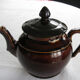 Old brown glazed ceramic coffee pot