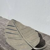 Silver metal leaf pocket emptier