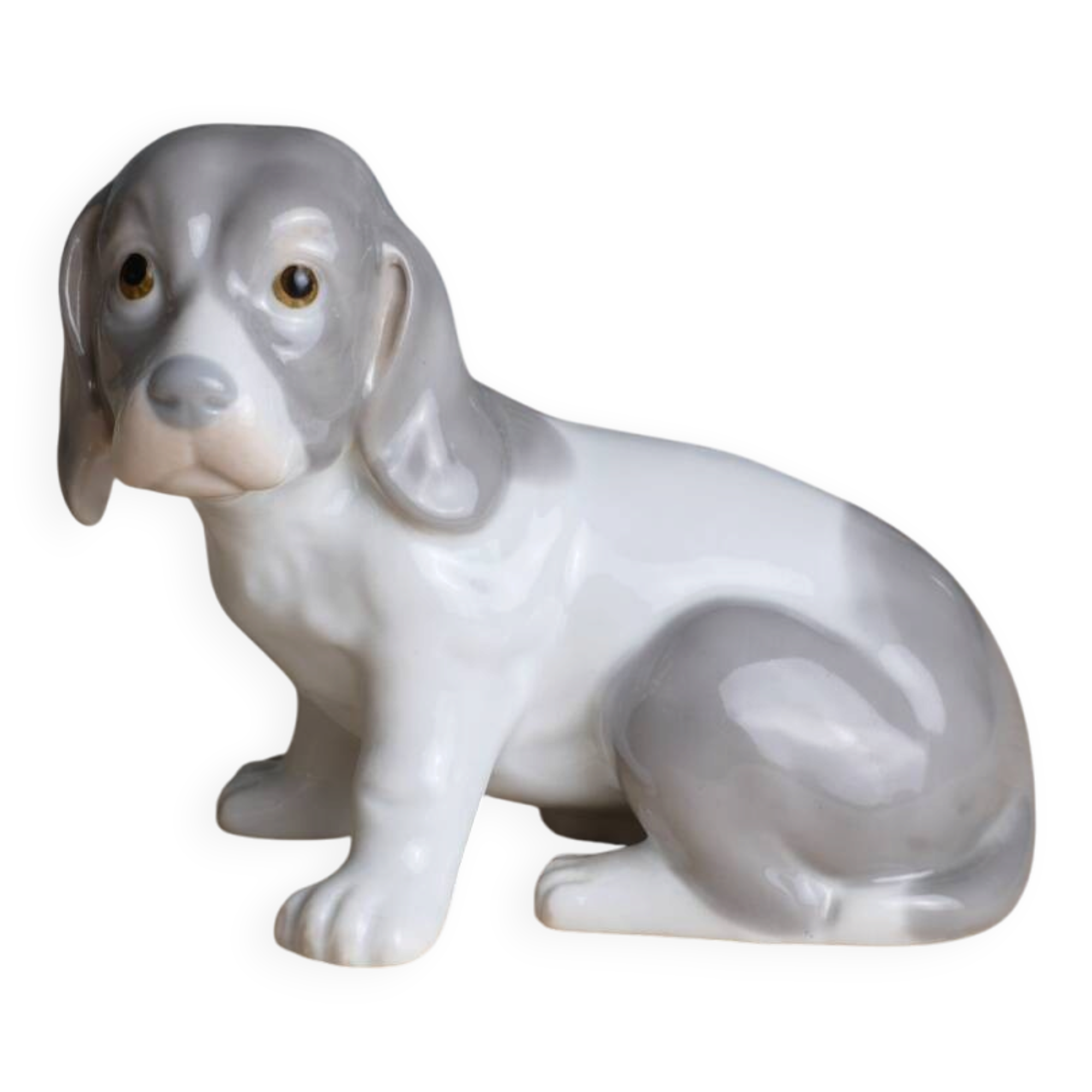 Small spaniel dog in porcelain
