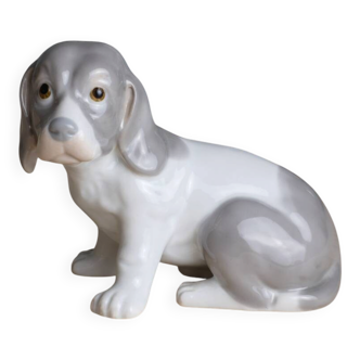 Small spaniel dog in porcelain