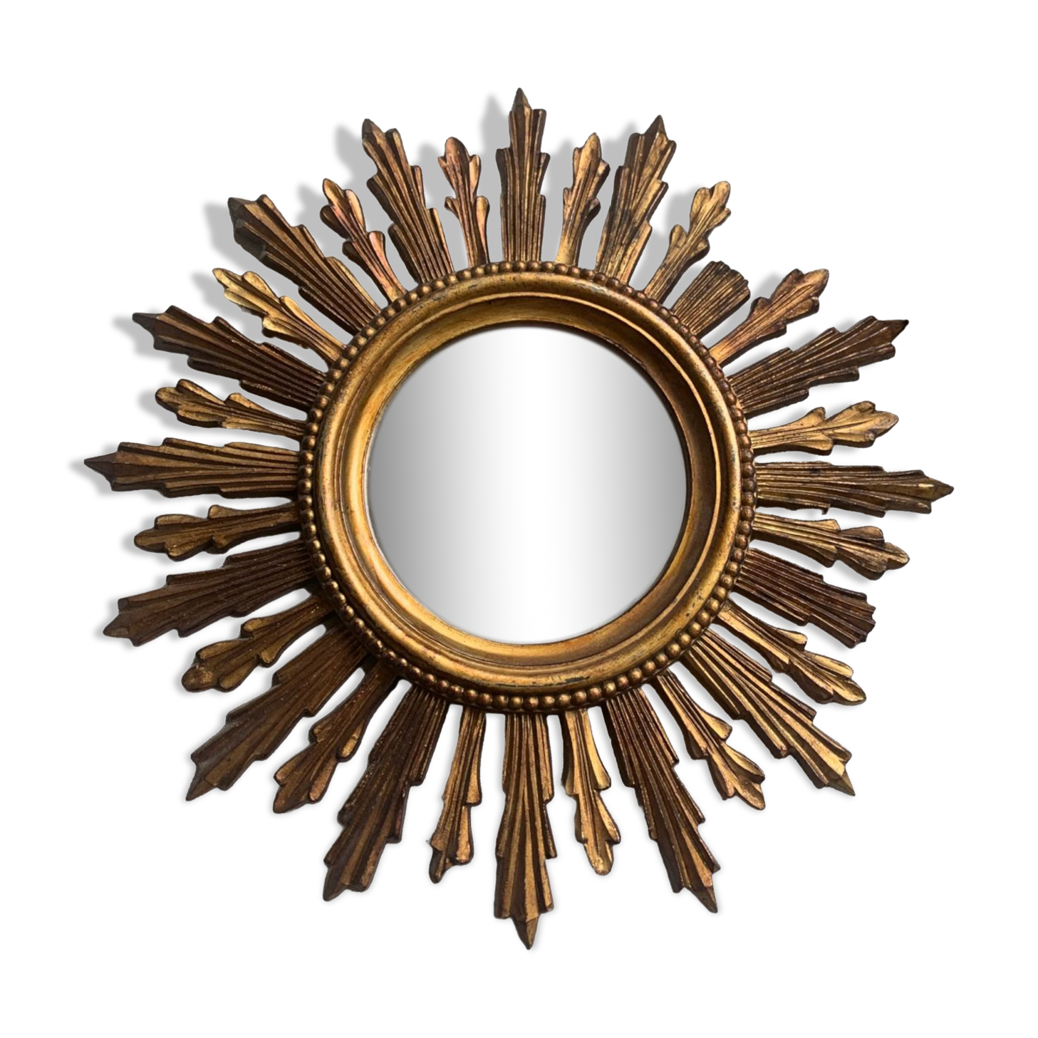 Sun mirror in old wood