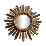Sun mirror in old wood