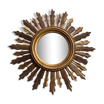 Sun mirror in old wood