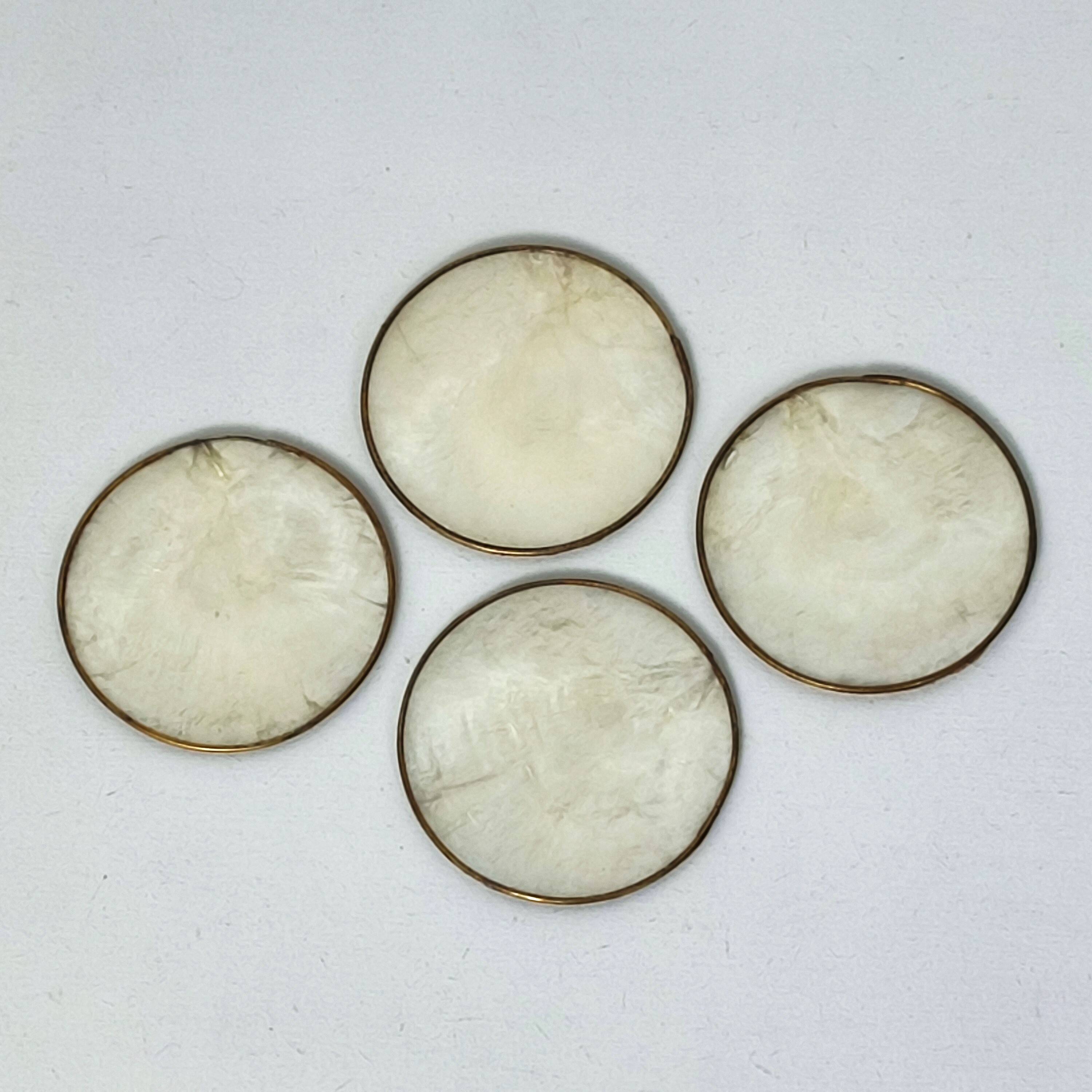 Under mother-of-pearl glasses