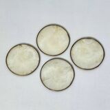 Under mother-of-pearl glasses