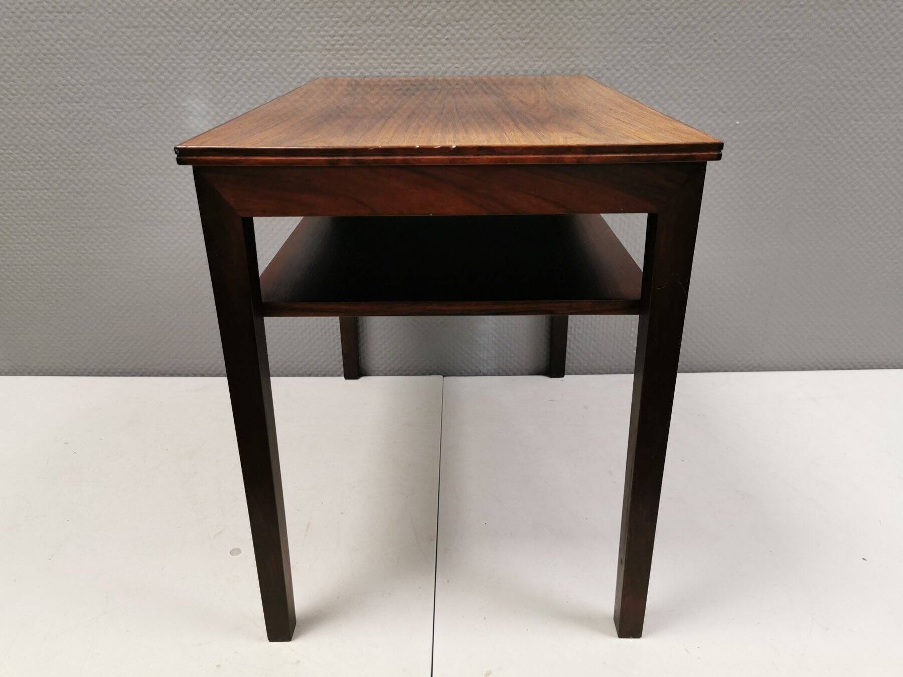 Nice side table in rosewood, probably Danish and from the 60s.
