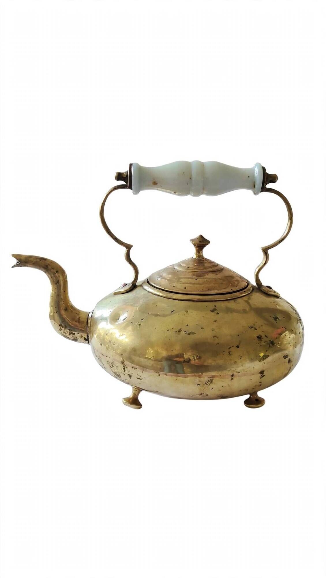 Victorian tripod kettle made of brass with a porcelain handle.