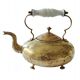 Victorian tripod kettle made of brass with a porcelain handle.